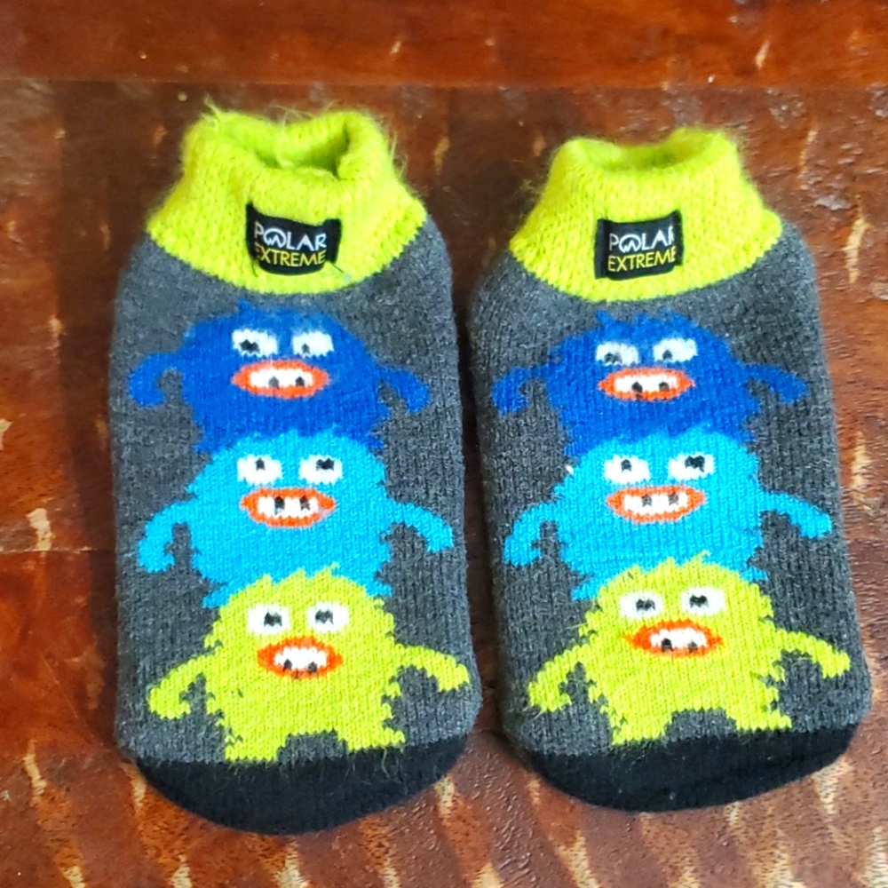 Fluffy socks with‎ three monsters.